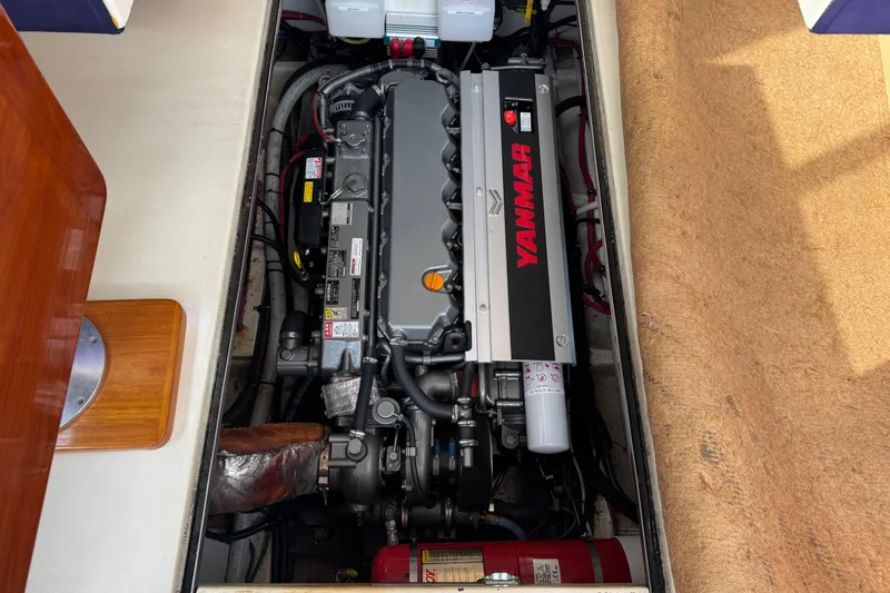 Slide: The Image of Engine compartment of 2001 Ellis 36 Flybridge with Yanmar engine visible. - 33