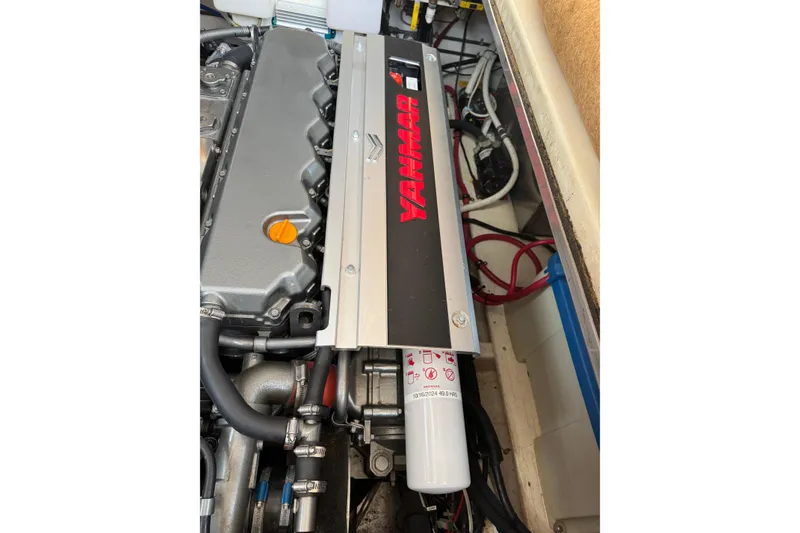 Slide: The Image of Engine compartment of 2001 Ellis 36 Flybridge with Yanmar engine visible. - 36
