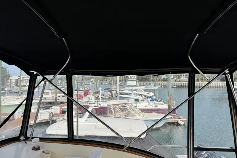 Slide: The Image of View from Ellis 36 Flybridge 2001, overlooking marina with multiple boats docked. - 44