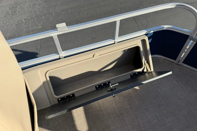 Slide: The Image of 2022 Sun Tracker Fishin' Barge 22 DLX storage compartment with open hatch. - 23