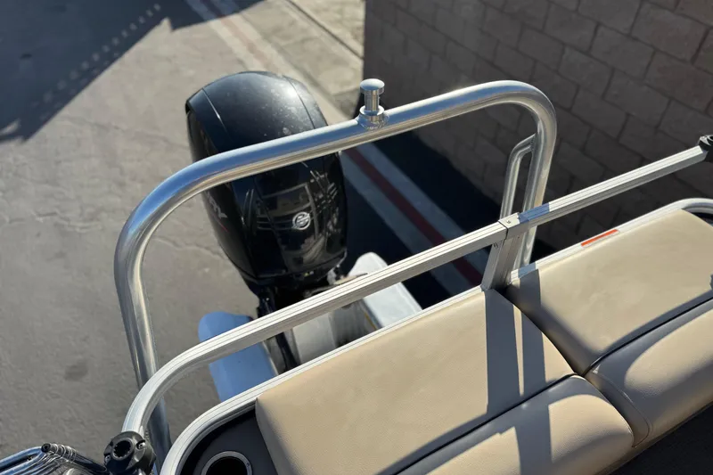 Slide: The Image of 2022 Sun Tracker Fishin' Barge 22 DLX with outboard motor and beige seating. - 27