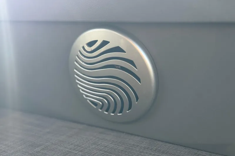 Slide: The Image of Close-up of a 2022 Sun Tracker Fishin' Barge 22 DLX speaker grille. - 29