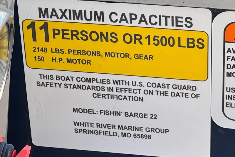 Slide: The Image of 2022 Sun Tracker Fishin' Barge 22 DLX capacity label, 11 persons or 1500 lbs. - 36