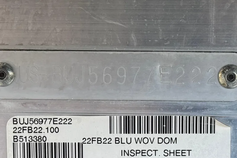 Slide: The Image of 2022 Sun Tracker Fishin' Barge 22 DLX identification plate with serial number and inspection label. - 37