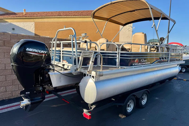 Slide: The Image of 2022 Sun Tracker Fishin' Barge 22 DLX pontoon boat with Mercury engine and canopy. - 6