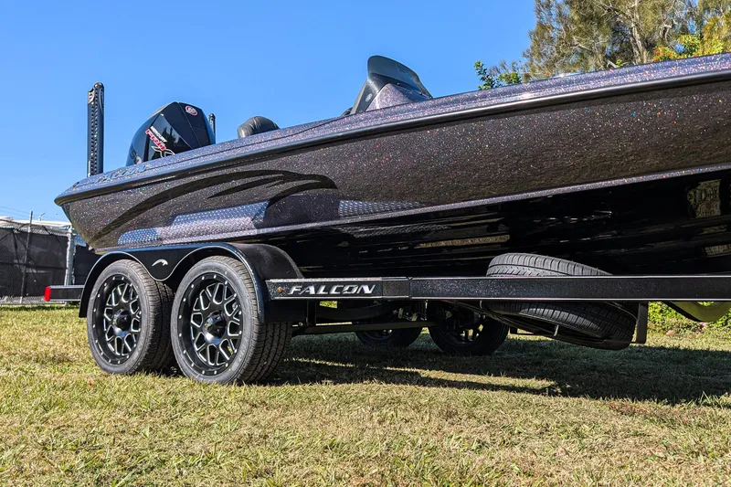 Slide: The Image of 2026 Falcon F20 PREDATOR boat on trailer, showcasing sleek design and dual wheels. - 11