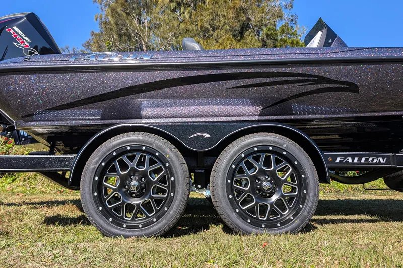 Slide: The Image of 2026 Falcon F20 PREDATOR boat trailer with stylish black wheels and sleek design. - 12