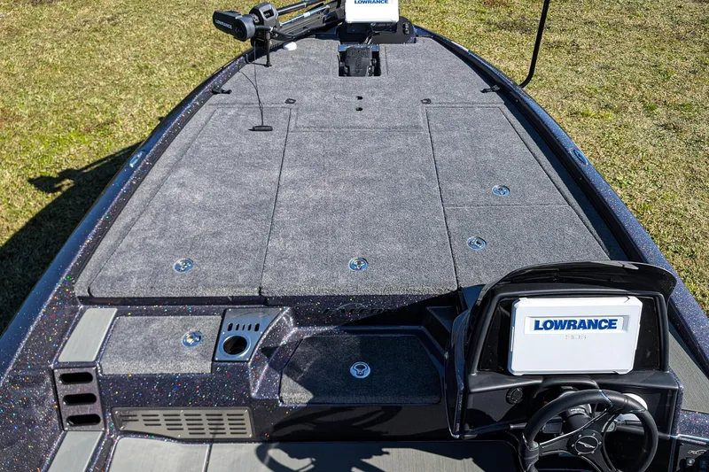 Slide: The Image of Falcon F20 PREDATOR 2026 boat deck with Lowrance electronics, carpeted surface, and steering console. - 14