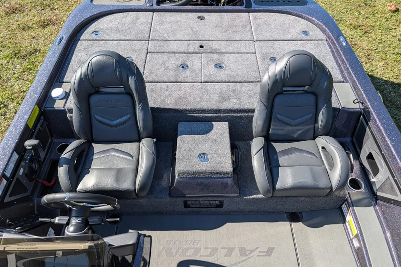 Slide: The Image of 2026 Falcon F20 PREDATOR boat interior with dual leather seats and carpeted deck. - 18