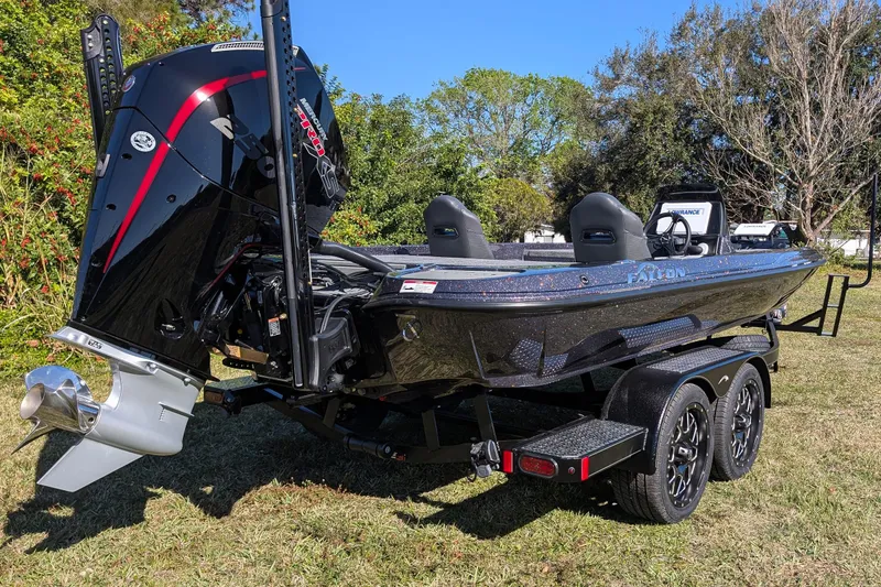 Slide: The Image of 2026 Falcon F20 PREDATOR boat on trailer, featuring powerful outboard motor. - 9