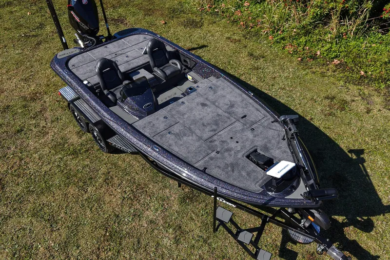 Slide: The Image of 2026 Falcon F20 PREDATOR fishing boat on grass, showcasing spacious deck and seating. - 1