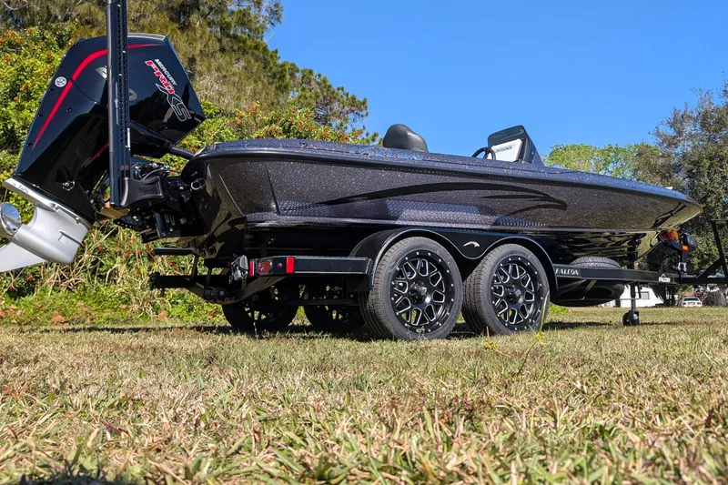 Slide: The Image of 2026 Falcon F20 PREDATOR boat on trailer, showcasing sleek design and powerful engine. - 8