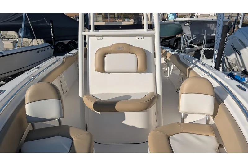 Slide: The Image of 2016 Key West 219 FS boat interior with beige and white seating. - 17