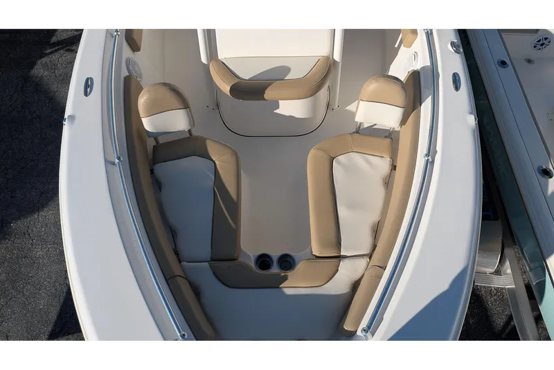 Slide: The Image of 2016 Key West 219 FS boat interior with tan and white seating. - 18