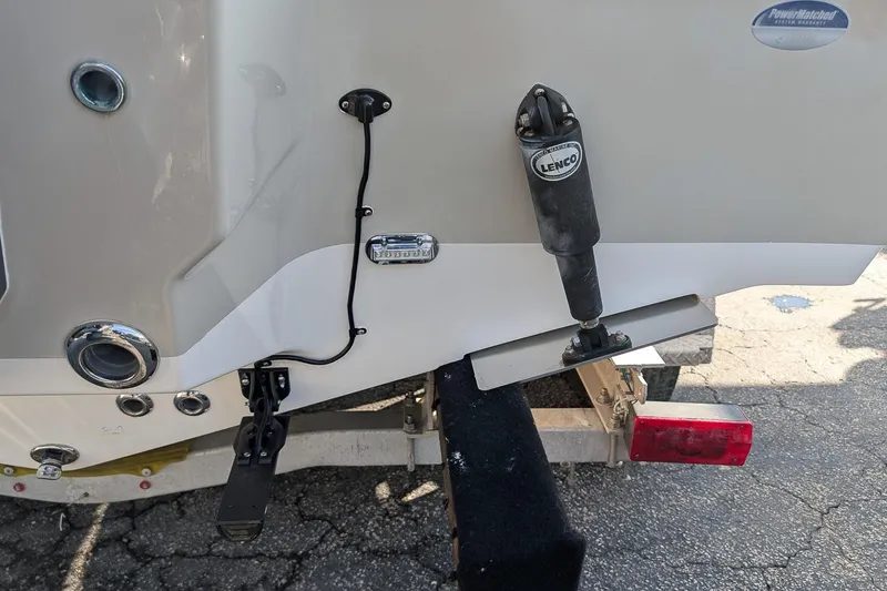 Slide: The Image of 2016 Key West 219 FS boat stern with Lenco trim tab and trailer. - 3