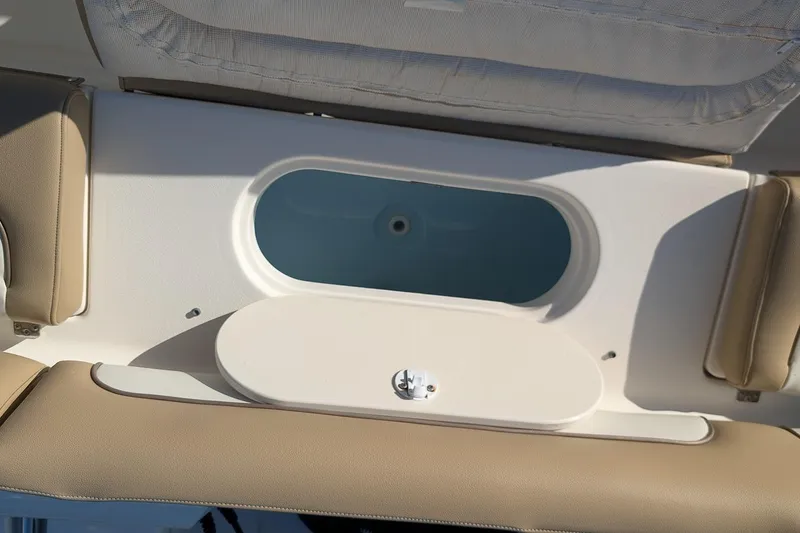 Slide: The Image of 2016 Key West 219 FS boat interior with open storage compartment. - 8