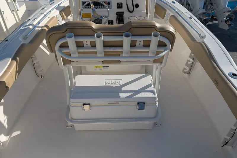 Slide: The Image of 2016 Key West 219 FS boat interior with seating and cooler storage. - 9