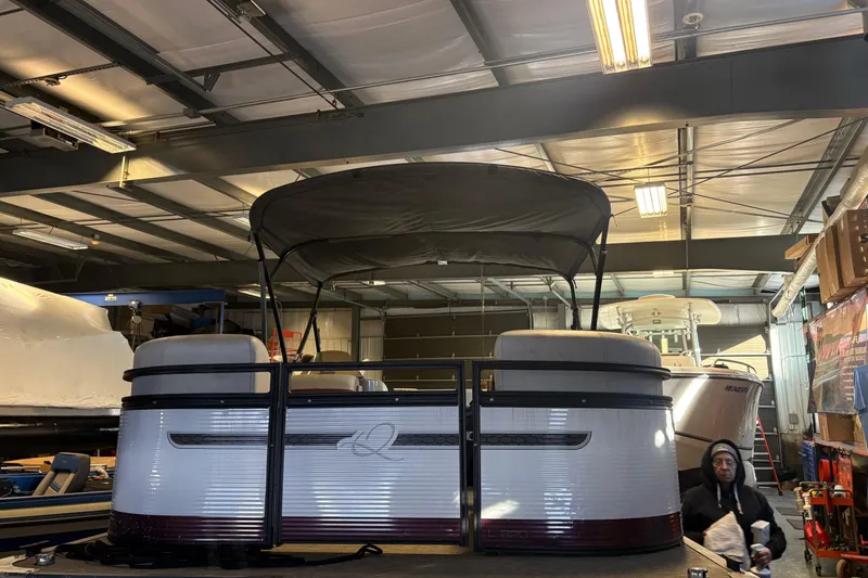 The Image of 2023 Qwest Lanai 820 pontoon boat in a storage facility. - 0