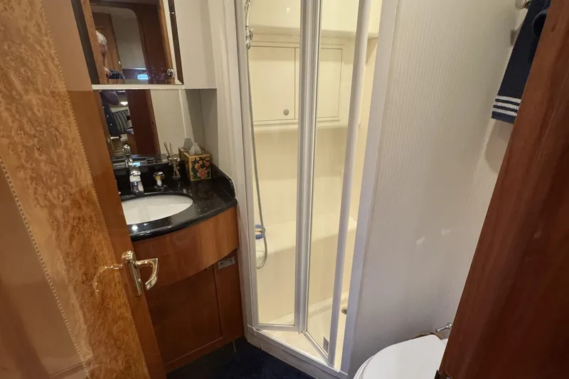 Slide: The Image of Luxurious bedroom interior of 2003 Altima 55 Pilothouse yacht with elegant wood finishes. - 39