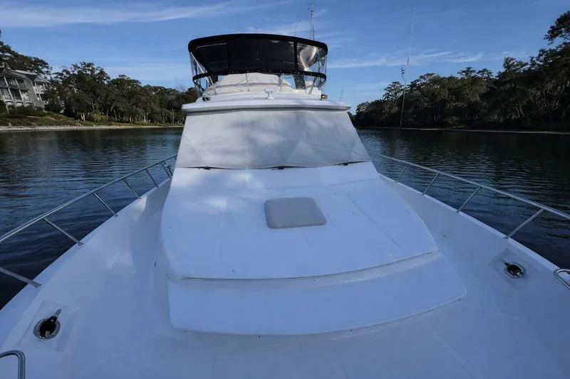 Slide: The Image of Bow of 2003 Altima 55 Pilothouse yacht with anchor system and railing. - 4