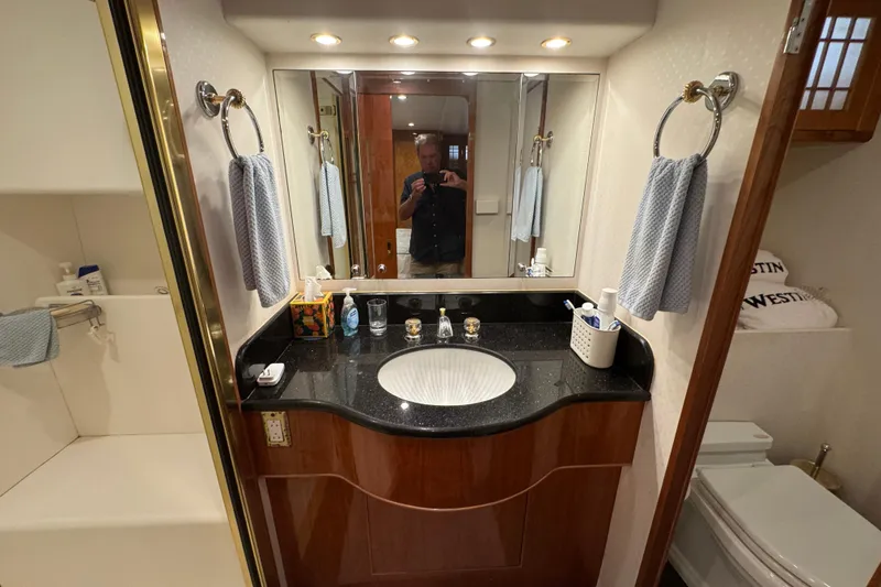 Slide: The Image of Wooden staircase with carpeted steps and handrail on a 2003 Altima 55 Pilothouse yacht. - 47