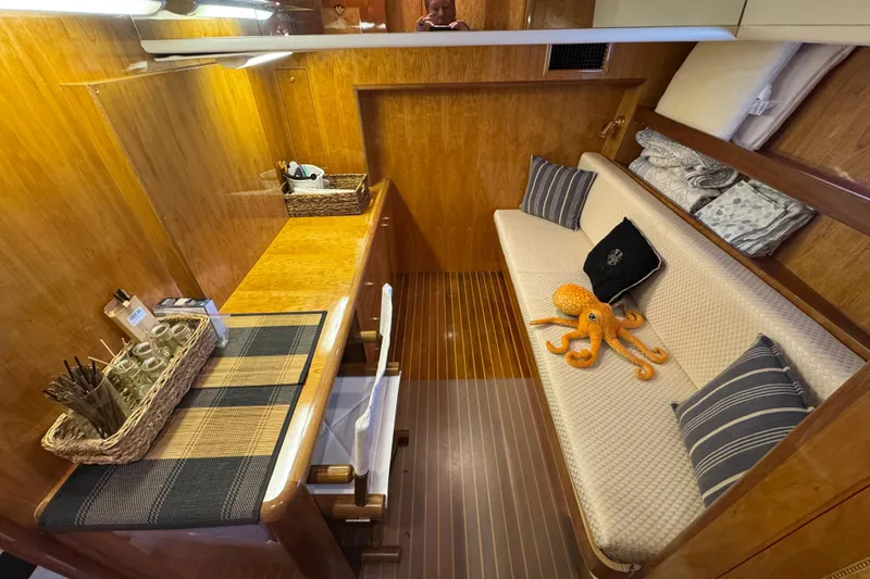 Slide: The Image of Staircase in 2003 Altima 55 Pilothouse with dolphin sculpture and wooden finish. - 51