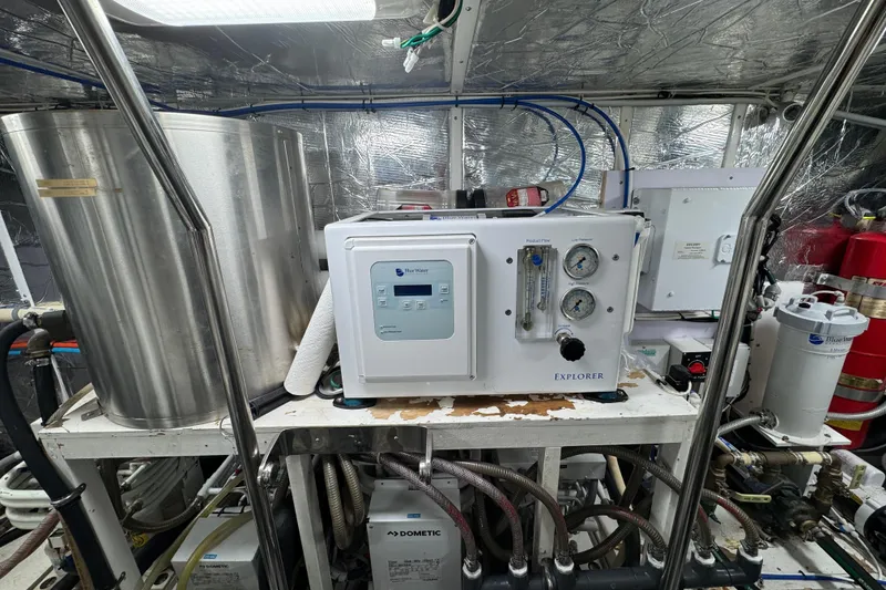 Slide: The Image of Engine room of 2003 Altima 55 Pilothouse with metallic insulation and machinery. - 62