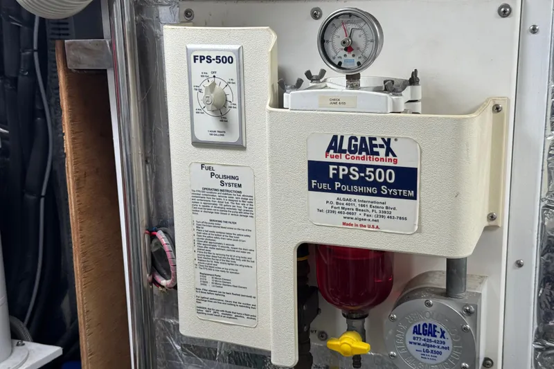 Slide: The Image of Propeller of 2003 Altima 55 Pilothouse boat, resting on a carpeted surface. - 64