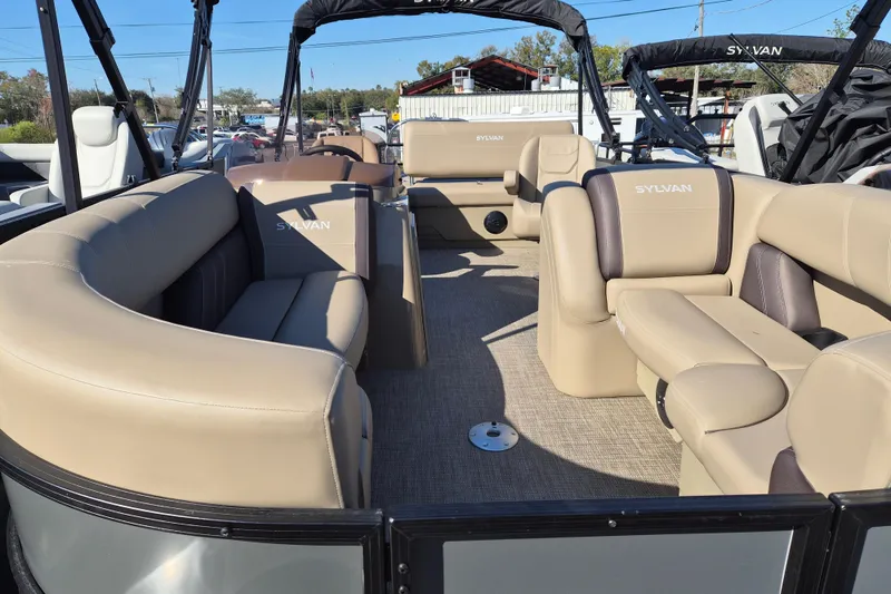 Slide: The Image of 2026 Sylvan MIRAGE 822 CLZ DH pontoon boat with spacious beige seating and modern design. - 4
