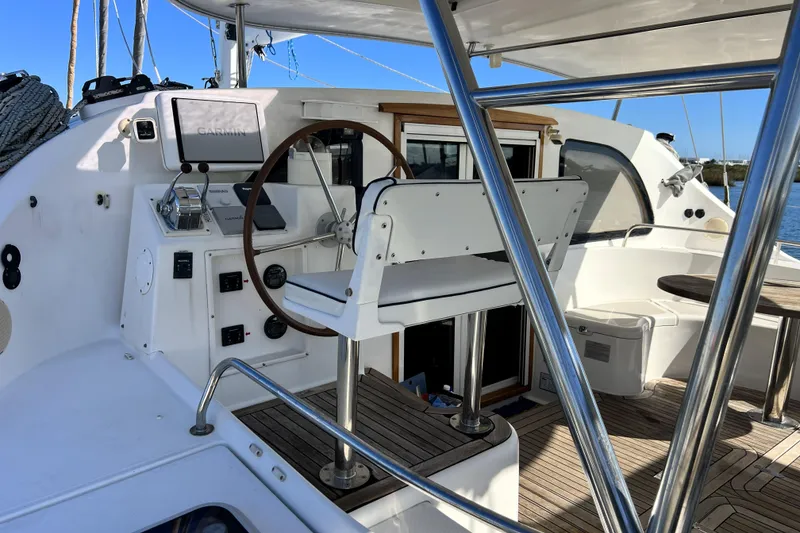 Slide: The Image of Steering area of 2011 Privilege 495 yacht with navigation equipment and seating. - 10