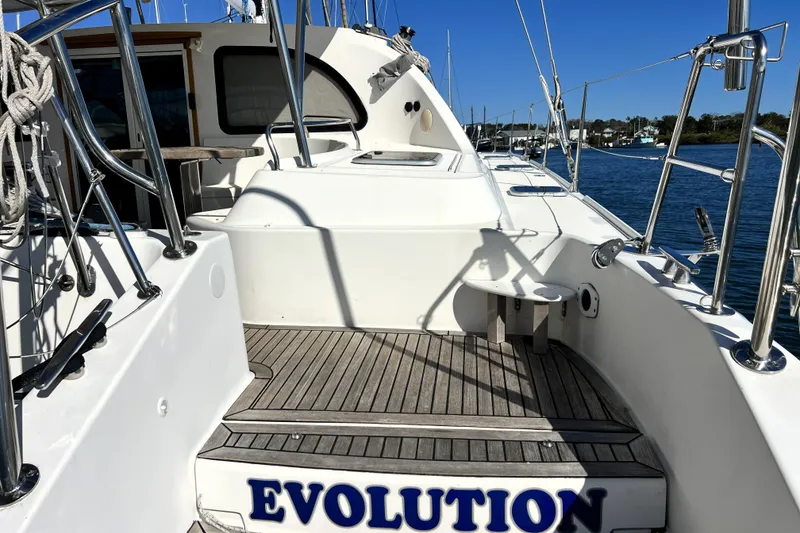 Slide: The Image of Luxury Privilege 495 yacht deck, 2011 model, with wooden flooring and sleek design. - 14