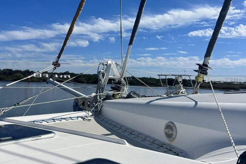 Slide: The Image of Sailing catamaran Privilege 495, 2011 model, on calm waters under a blue sky. - 20