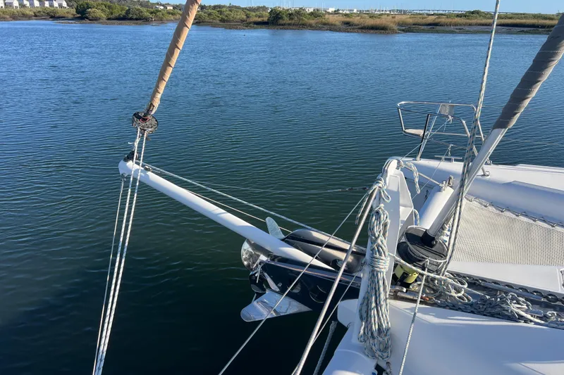 Slide: The Image of Sailing catamaran Privilege 495, 2011 model, anchored in calm waters. - 24