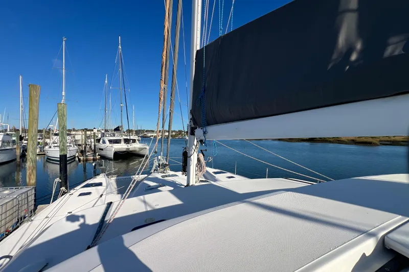 Slide: The Image of Sailing yacht Privilege 495, 2011 model, docked in a marina under clear blue skies. - 25