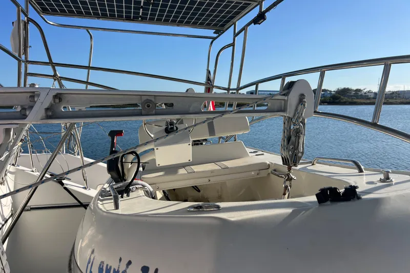 Slide: The Image of Sailing yacht Privilege 495, 2011 model, featuring deck and solar panel, docked by the water. - 33