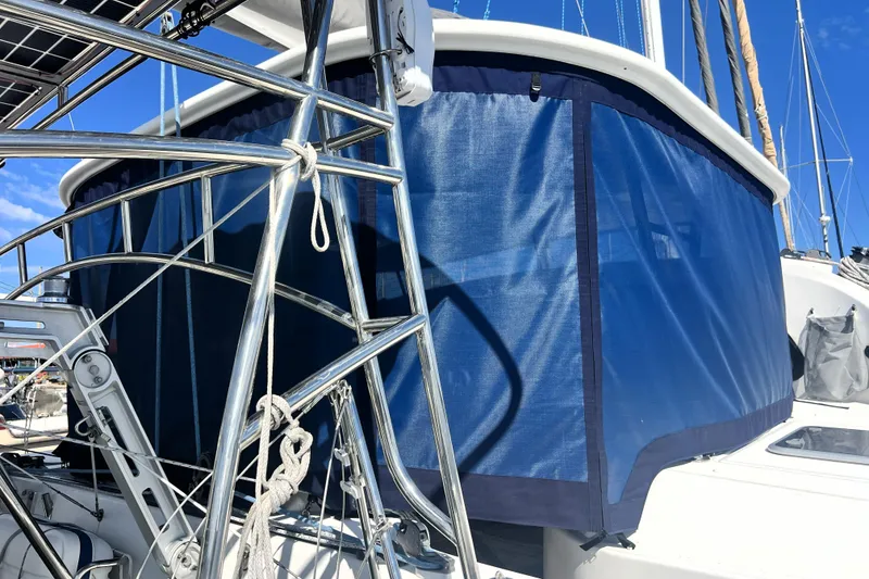 Slide: The Image of Sailing yacht Privilege 495, 2011 model, featuring blue canvas and stainless steel railings. - 37