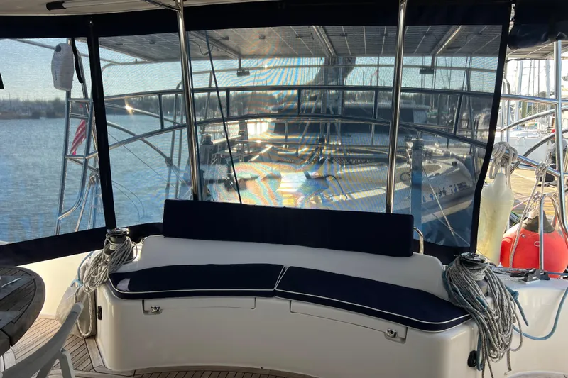 Slide: The Image of Luxury Privilege 495 yacht cockpit with seating, ropes, and marina view, 2011 model. - 45