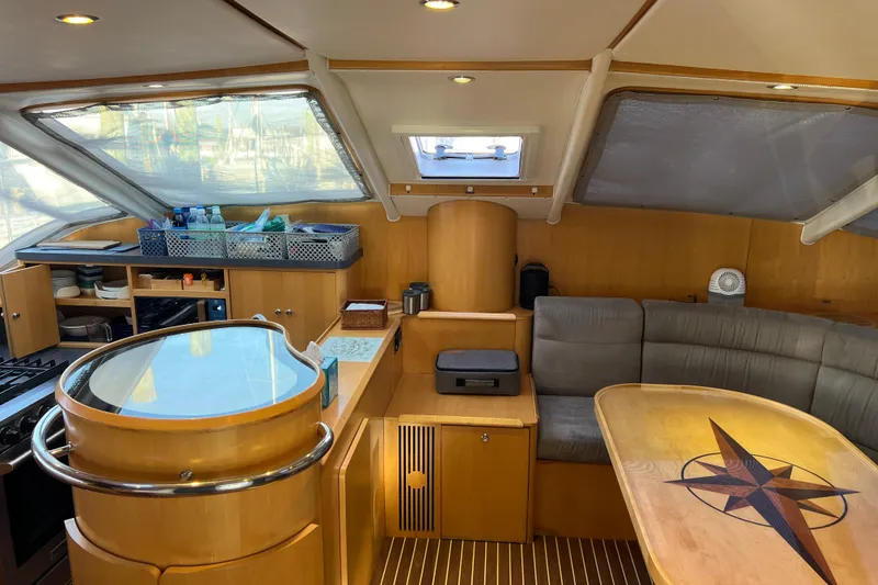 Slide: The Image of Luxurious 2011 Privilege 495 yacht interior with modern kitchen and cozy seating area. - 49