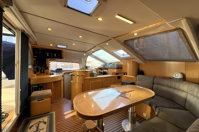 Slide: The Image of Luxurious interior of 2011 Privilege 495 yacht with modern seating and navigation area. - 50
