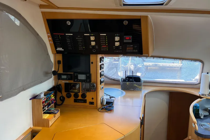Slide: The Image of Interior of 2011 Privilege 495 yacht with navigation equipment and organized workspace. - 51