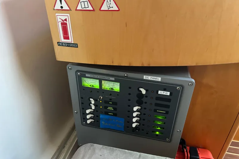 Slide: The Image of DC panel on Privilege 495 yacht, 2011 model, with safety and control indicators. - 54