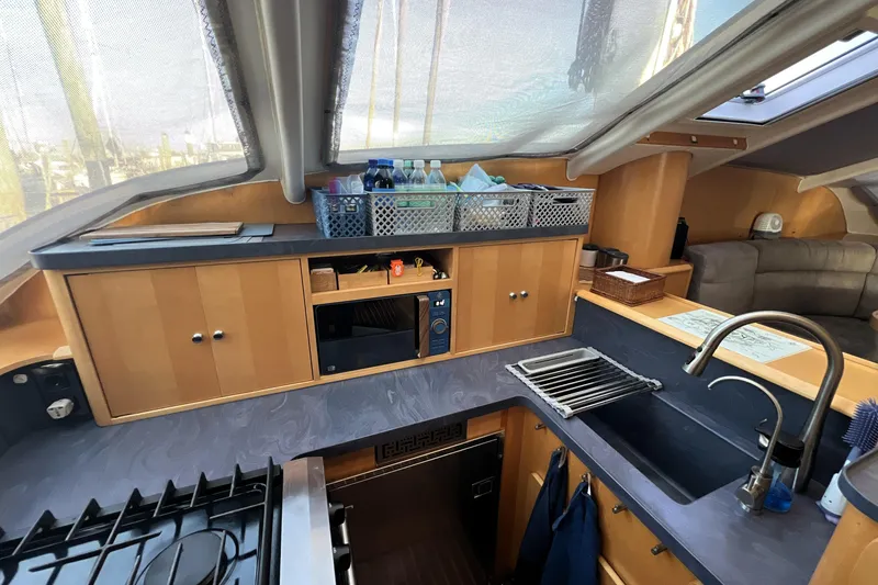 Slide: The Image of Luxurious 2011 Privilege 495 yacht kitchen with modern amenities and sleek design. - 62