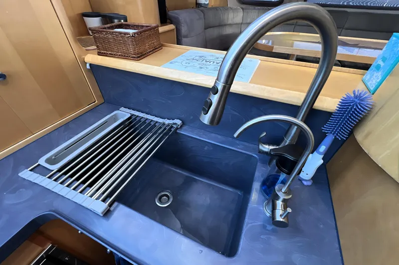Slide: The Image of Modern kitchen sink with stainless steel faucet in 2011 Privilege 495 yacht. - 63