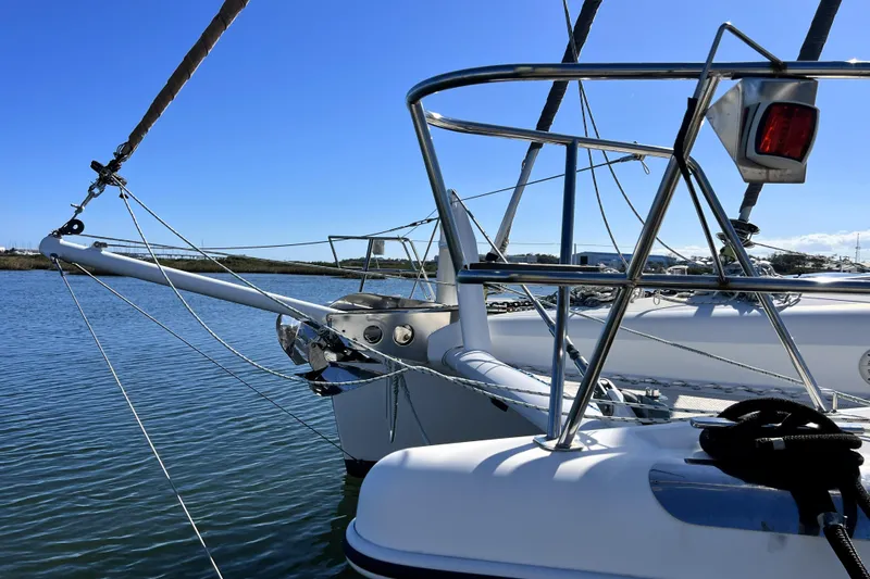 Slide: The Image of Sailing yacht Privilege 495, 2011 model, docked in calm waters under clear blue sky. - 7