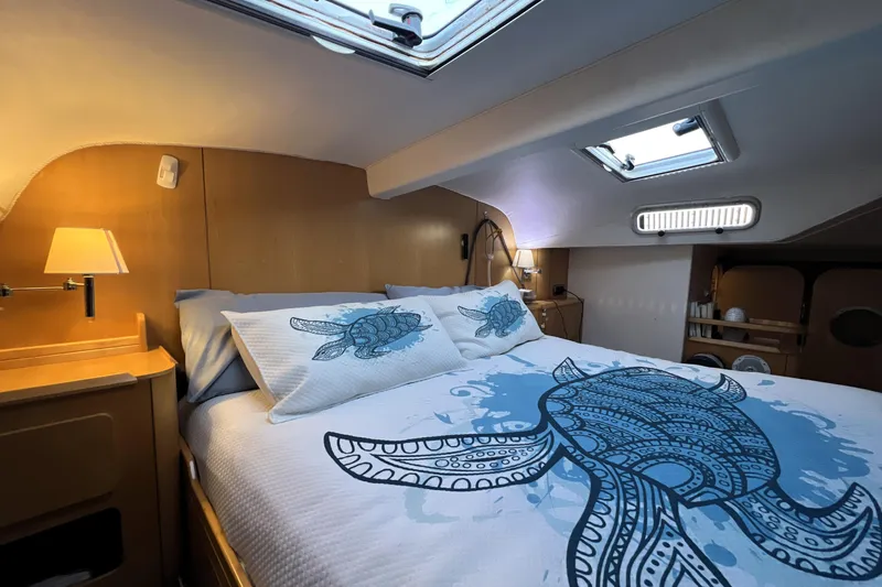 Slide: The Image of Luxurious cabin interior of 2011 Privilege 495 yacht with turtle-themed bedding. - 72