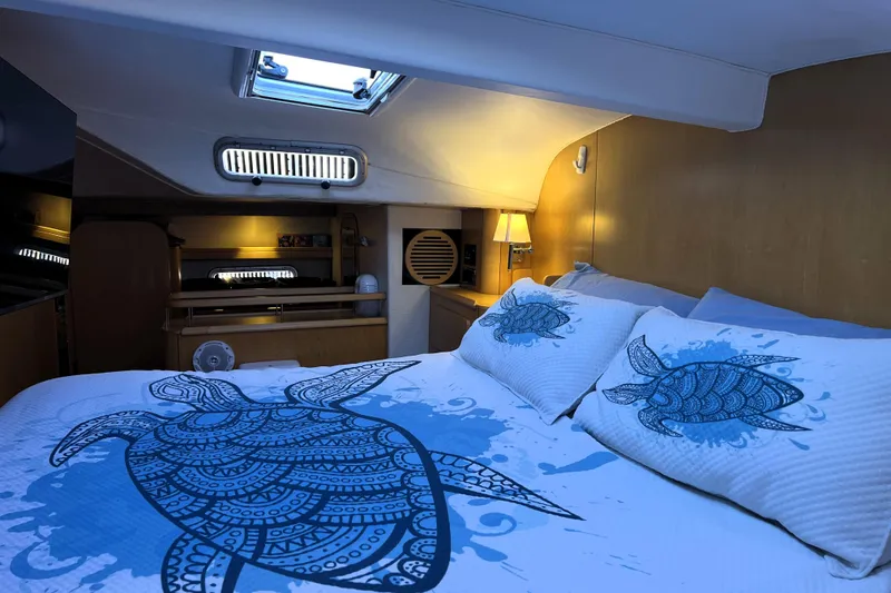 Slide: The Image of Cozy cabin interior of 2011 Privilege 495 yacht with turtle-themed bedding. - 73