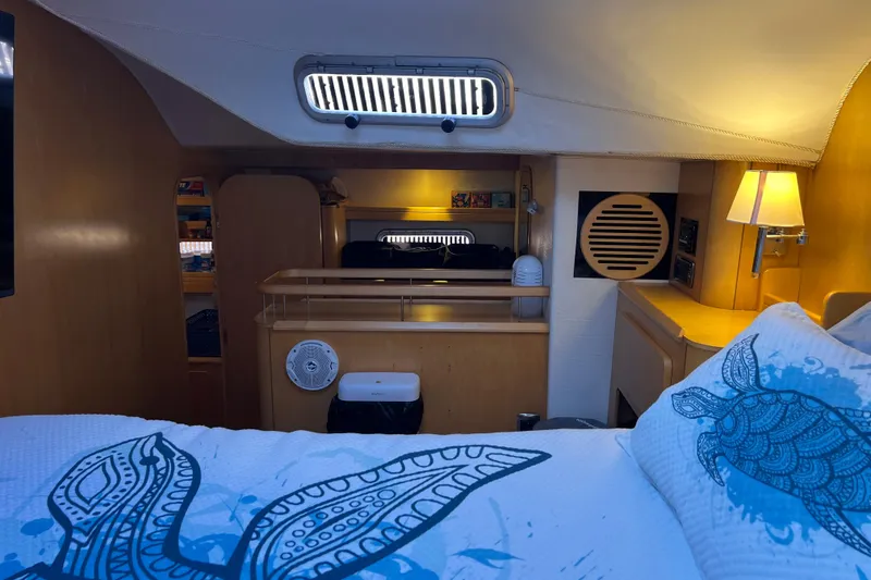Slide: The Image of Luxurious interior of 2011 Privilege 495 yacht with cozy bedding and ambient lighting. - 75