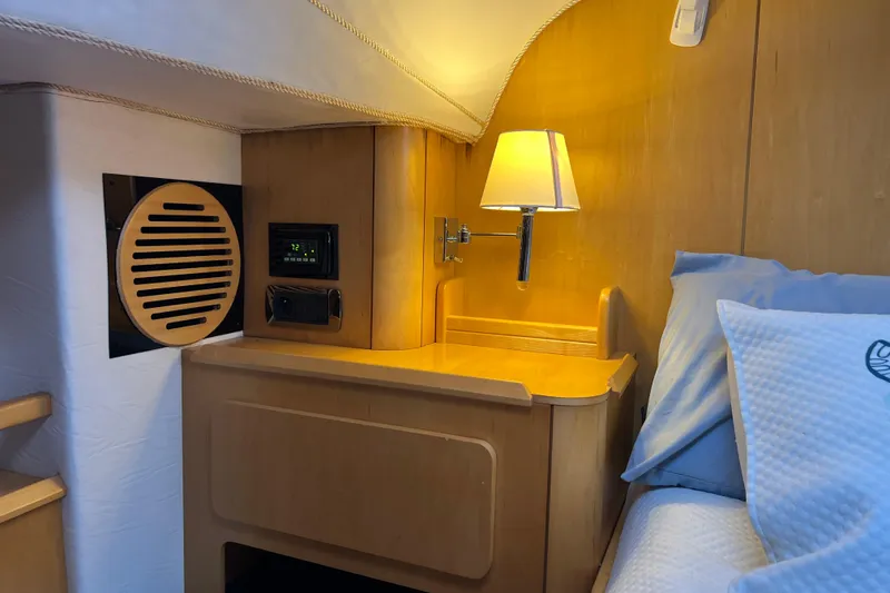 Slide: The Image of Cozy cabin interior of 2011 Privilege 495 yacht with wooden furnishings and ambient lighting. - 79