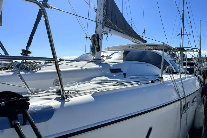 Slide: The Image of Sleek 2011 Privilege 495 yacht docked under clear blue sky. - 8
