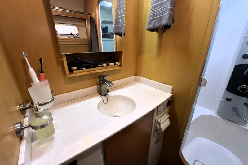 Slide: The Image of Bathroom interior of 2011 Privilege 495 yacht with sink, mirror, and shower. - 84